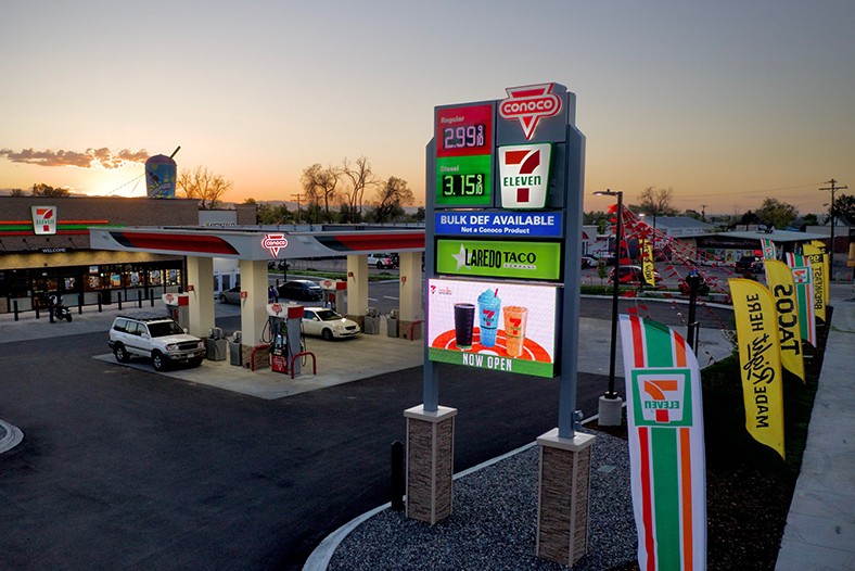 Custom property signage displaying business name and logo at a commercial location.