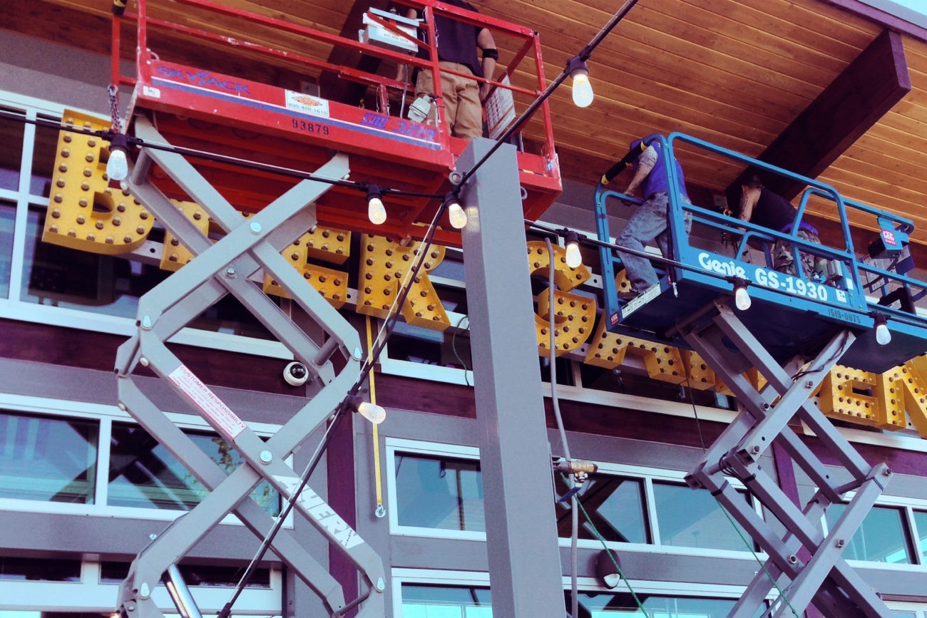 BSC Signs professionals installing a sign with precision and expertise